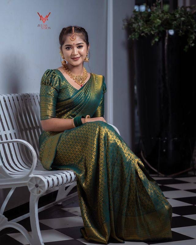 Dark Green Soft Lichi Silk Saree With Zari Weaving Work